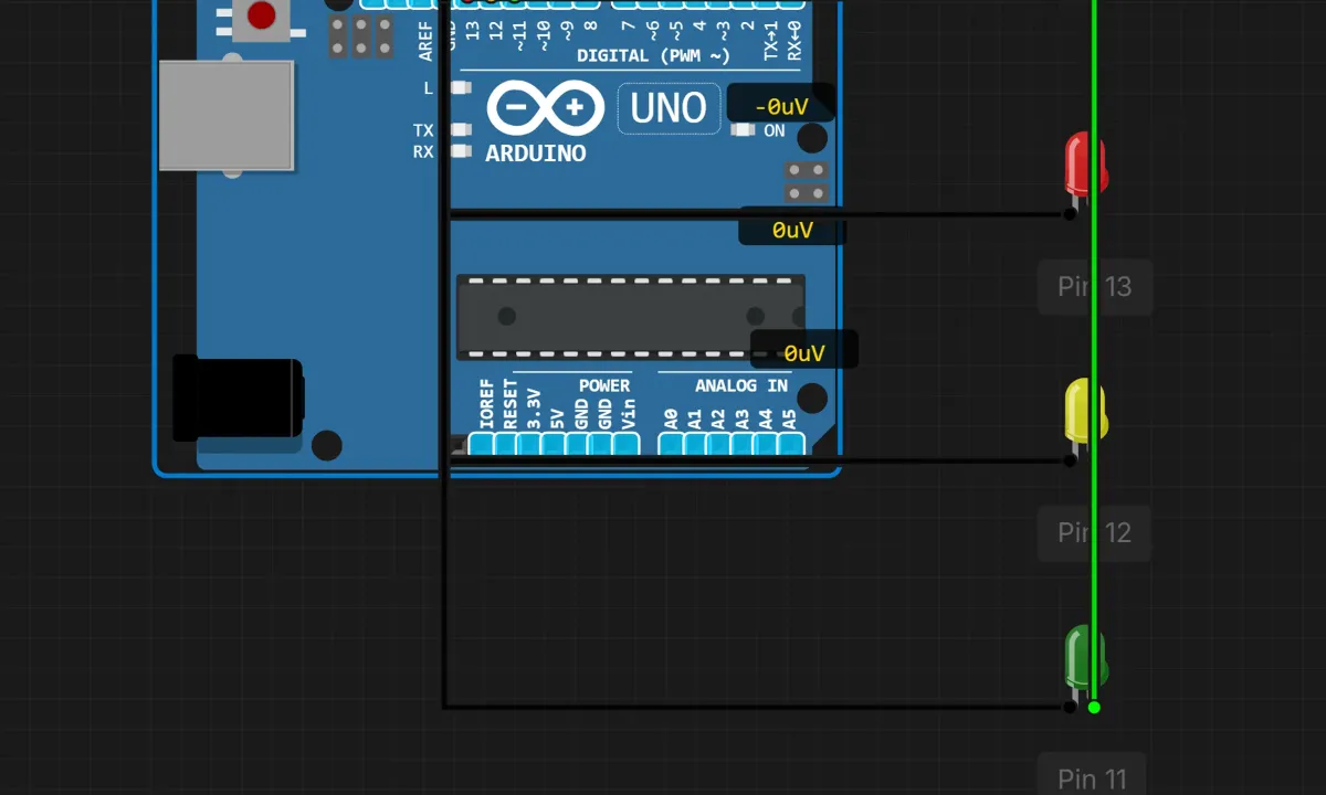 Arduino Uno wired to red, yellow and green LEDs on pins 13, 12 and 11 in a circuit simulator